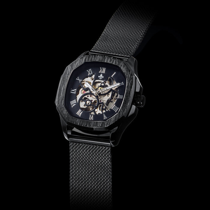 Black Mesh Interchangeable Strap men's luxury watch featuring a bold skeleton dial with Roman numerals, black brushed case, and a sleek black mesh bracelet, bold by design.