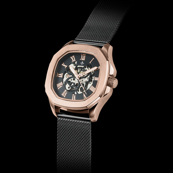 Men's luxury watch featuring a rose gold case with exposed mechanical details and Roman numeral markers, paired with a Black Mesh Interchangeable Strap by Ralph Christian, bold by design.