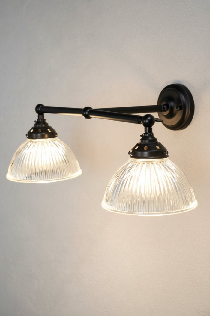Holophane glass double arm wall light with black sconce