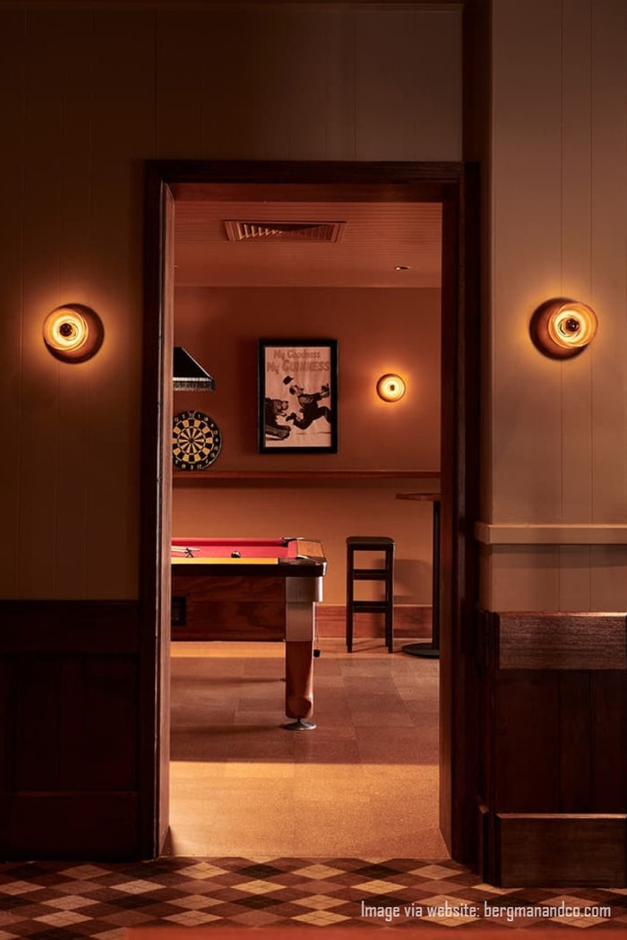 Image via website: bergmanandco.com. Orrong Pub showing three crosshatch glass wall lights with wood detailing in the pool room.