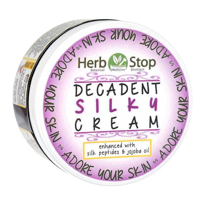 Jar of Herb Stop Decadent Silky Cream with purple label on a white background