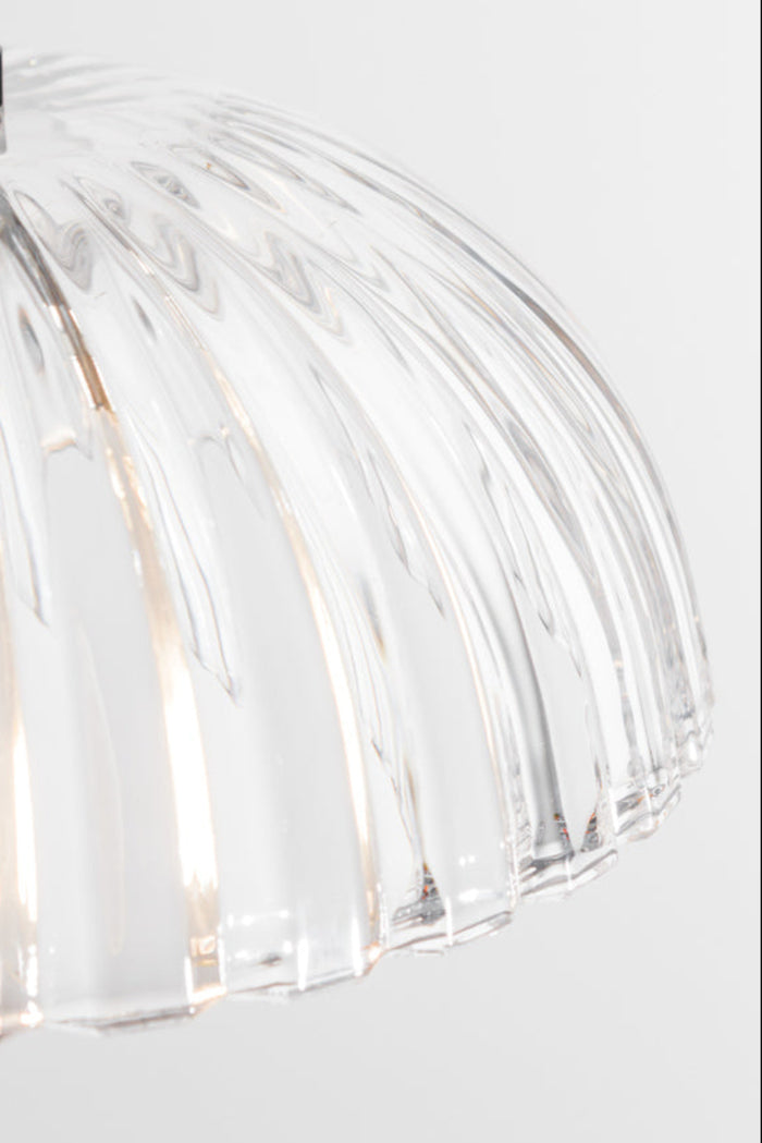 Close up of the fluting on the clear glass shade.
