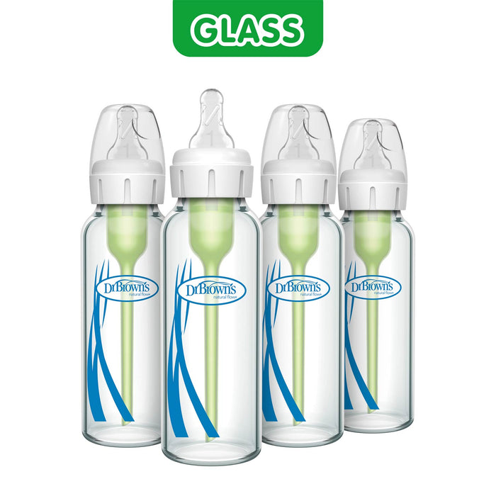 Four Dr. Brown's glass baby bottles with white caps and clear silicone nipples, arranged in a row on a white background with a green 'GLASS' label at the top.