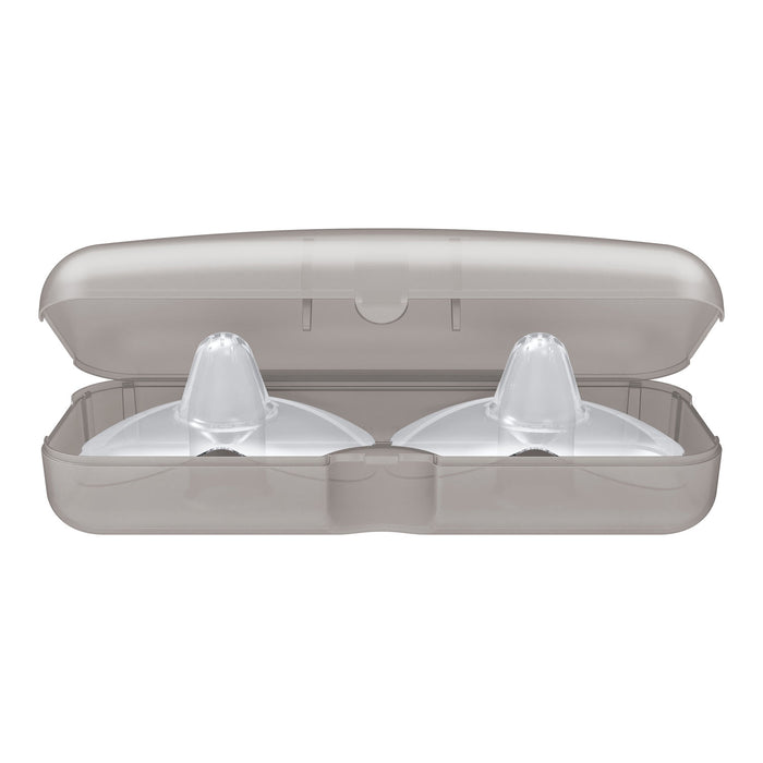Dr. Brown's™ Butterfly Nipple Shields by Dr. Brown's are two clear silicone nipple shields for breastfeeding, standing upright inside molded compartments of a gray plastic case with the lid open.