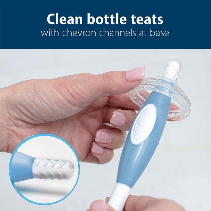 Person cleaning bottle teat with bottle brush