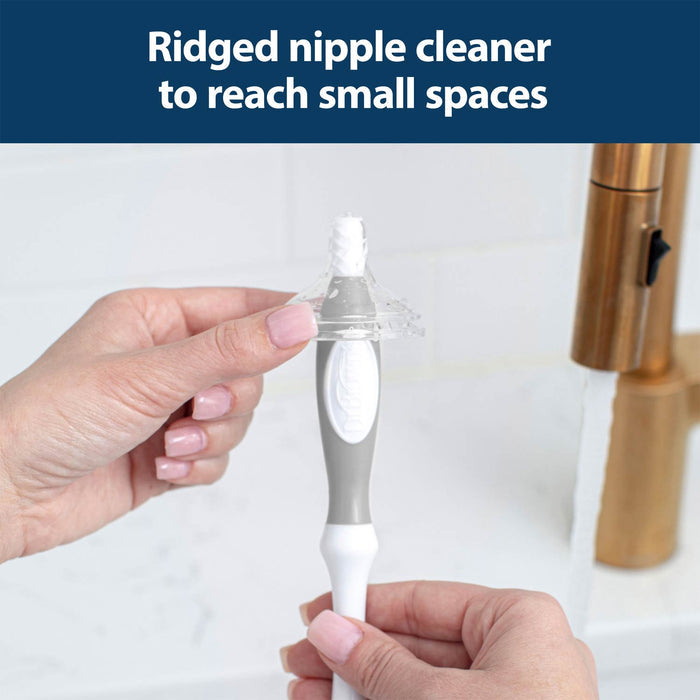 A person uses the Dr. Brown’s™ Deluxe Bottle Brush from Dr. Brown's under running water, cleaning it with their fingers to help keep baby bottles hygienic.