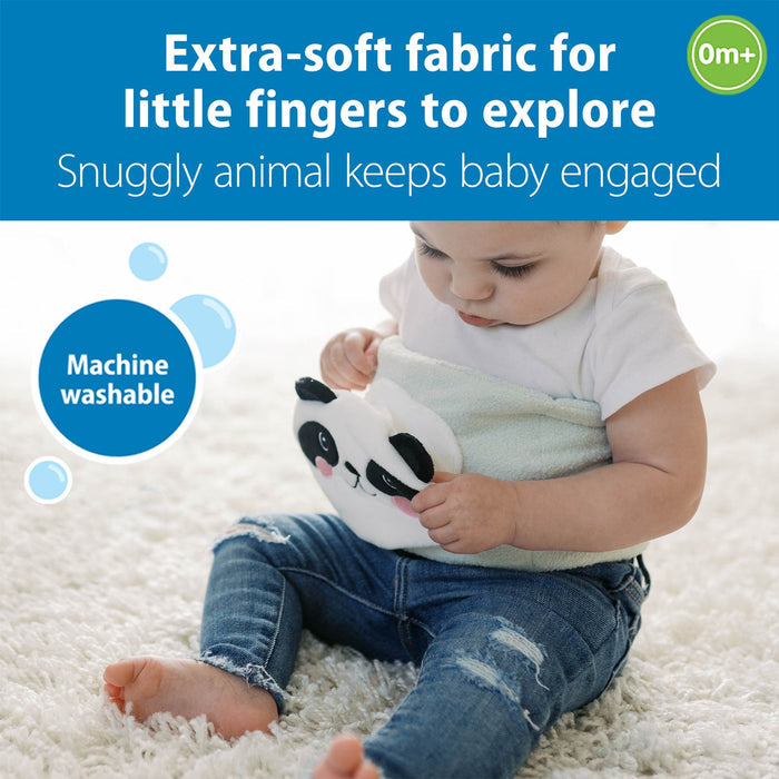 Baby holding a panda-shaped toy with text about extra-soft fabric and machine washability.