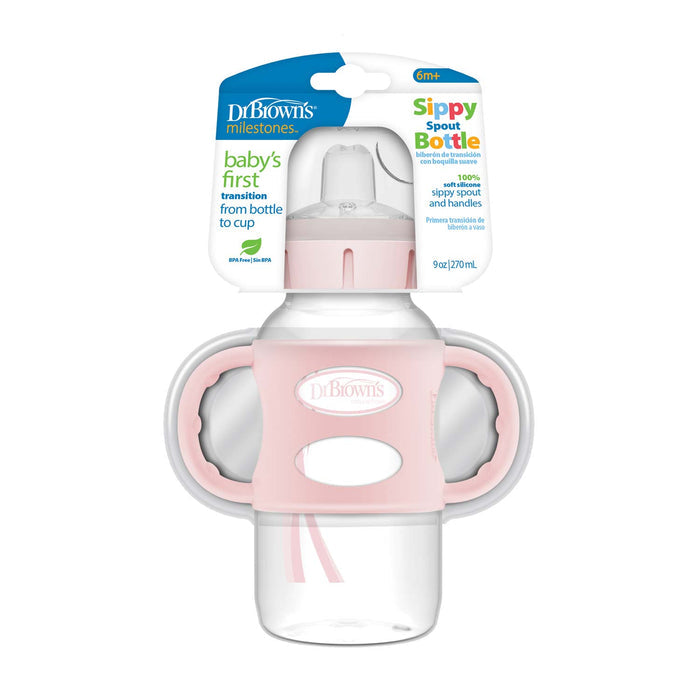 Dr. Brown's Milestones Wide-Neck Sippy Spout Bottle with Silicone Handles, 9 oz, is designed for babies 6 months+, featuring pink handles and packaging that highlights it as a transition bottle from bottle to cup.