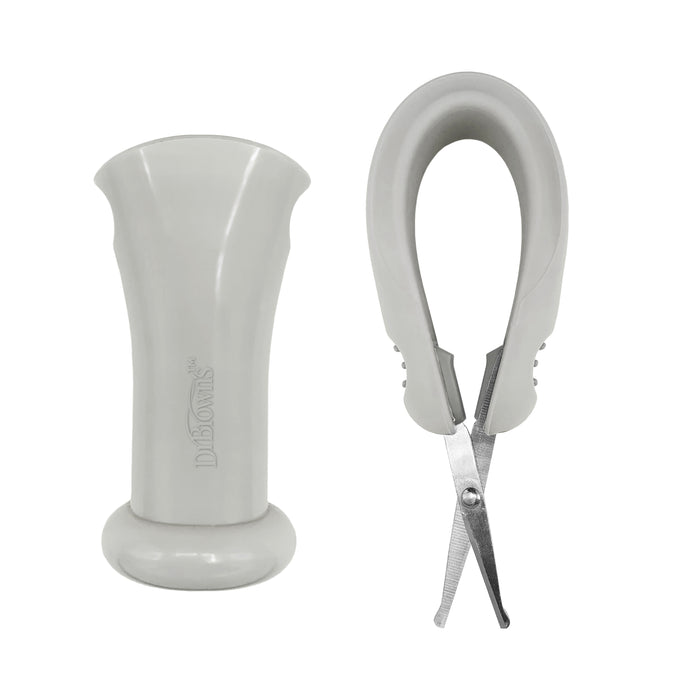A pair of light gray Dr. Brown's Safe Squeeze Nail Scissors with a rounded blade tip and a nail file stand side by side. The scissors feature a soft silicone handle for enhanced grip, while the file boasts a smooth, wide surface. Both are expertly designed to groom pets' nails safely and efficiently.