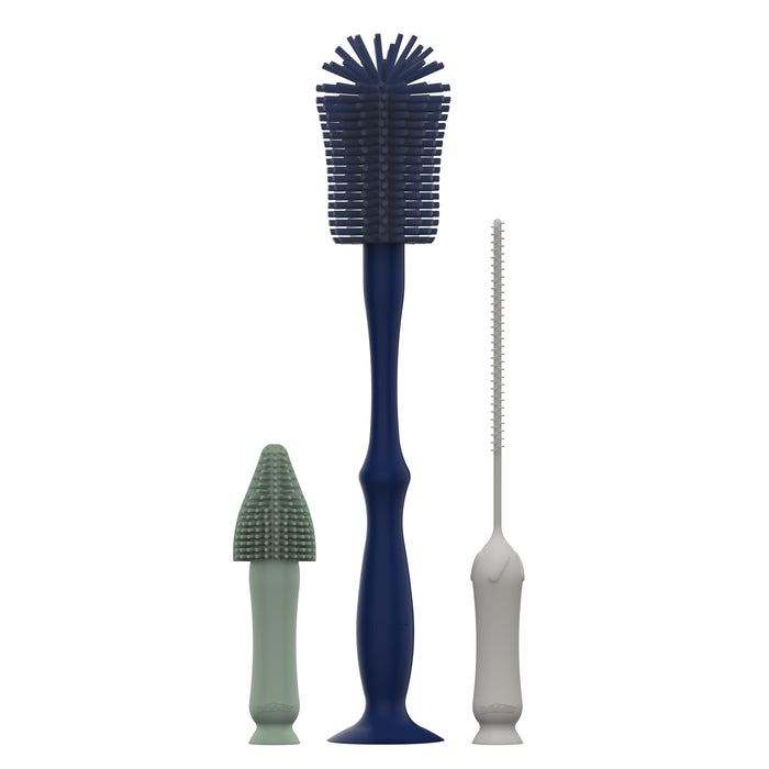 The Dr. Brown's® Silicone Cleaning Brush Set consists of three distinct brushes: a large blue star-shaped brush, a light green conical brush, and a thin white brush with narrow bristles. These are ideal for cleaning bottles and are displayed standing upright on a white background.