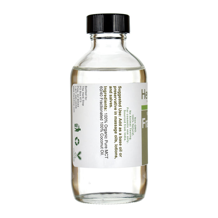 Bottle of Herb Stop Fractionated Coconut Oil on a white background