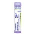 A tube of Boiron 200ck Gelsemium sempervirens with a white and purple label, set against a plain white background.