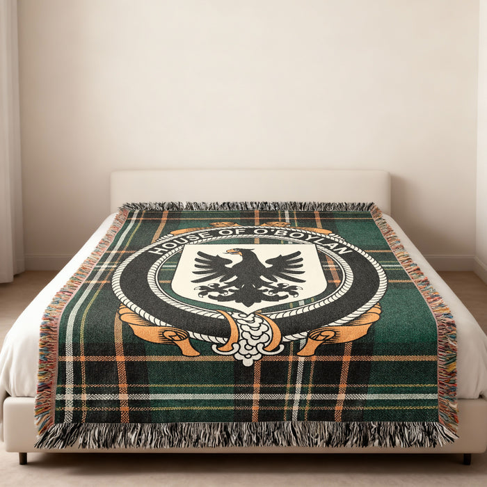 O'Boylan family crest emblem woven blanket displayed on a bed