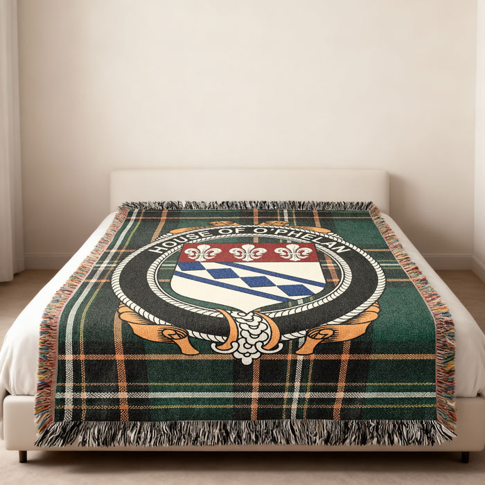 O'Phelan family crest emblem woven blanket displayed on a bed