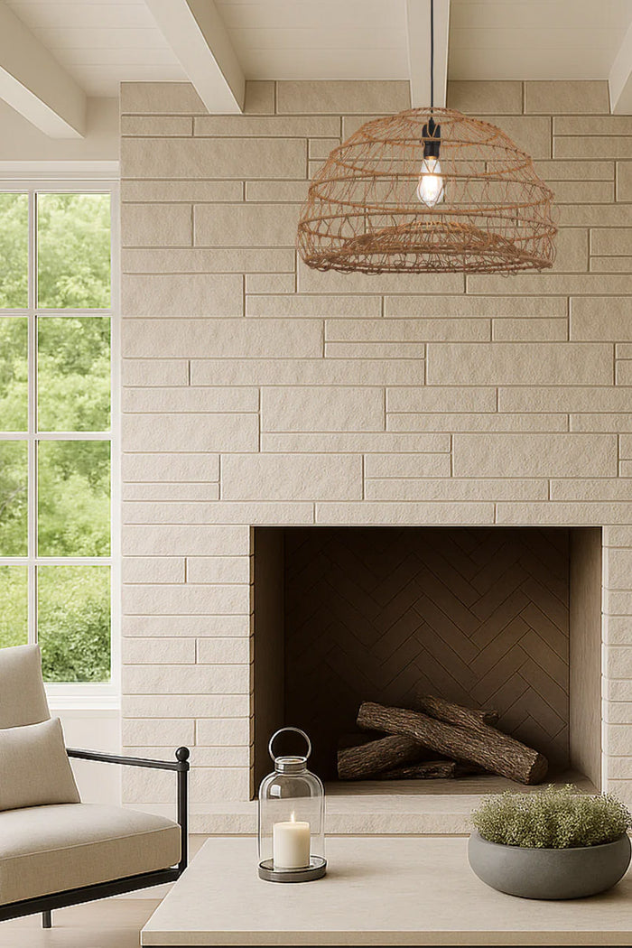Coastal woven pendant light styled above a fireplace with natural rattan open weave shade and warm organic texture